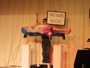 The Magician making Yaakov Singer, counselor, float in mid-air before Camp Simcha Special